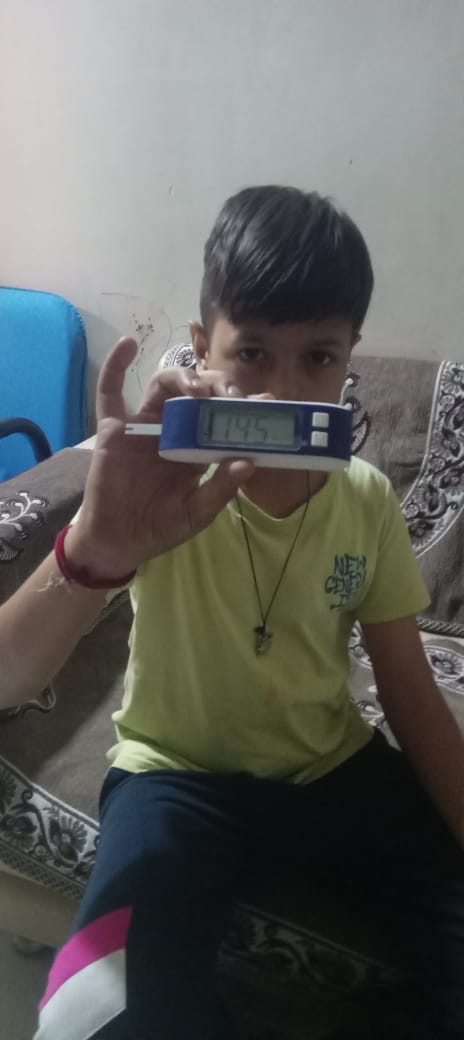 One of the children we support, keeping a close watch on his blood sugar